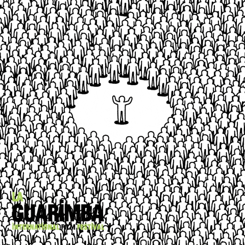 human figure in the center of a crowd putting his arms up and the whole crowd copies creating a mexican wave